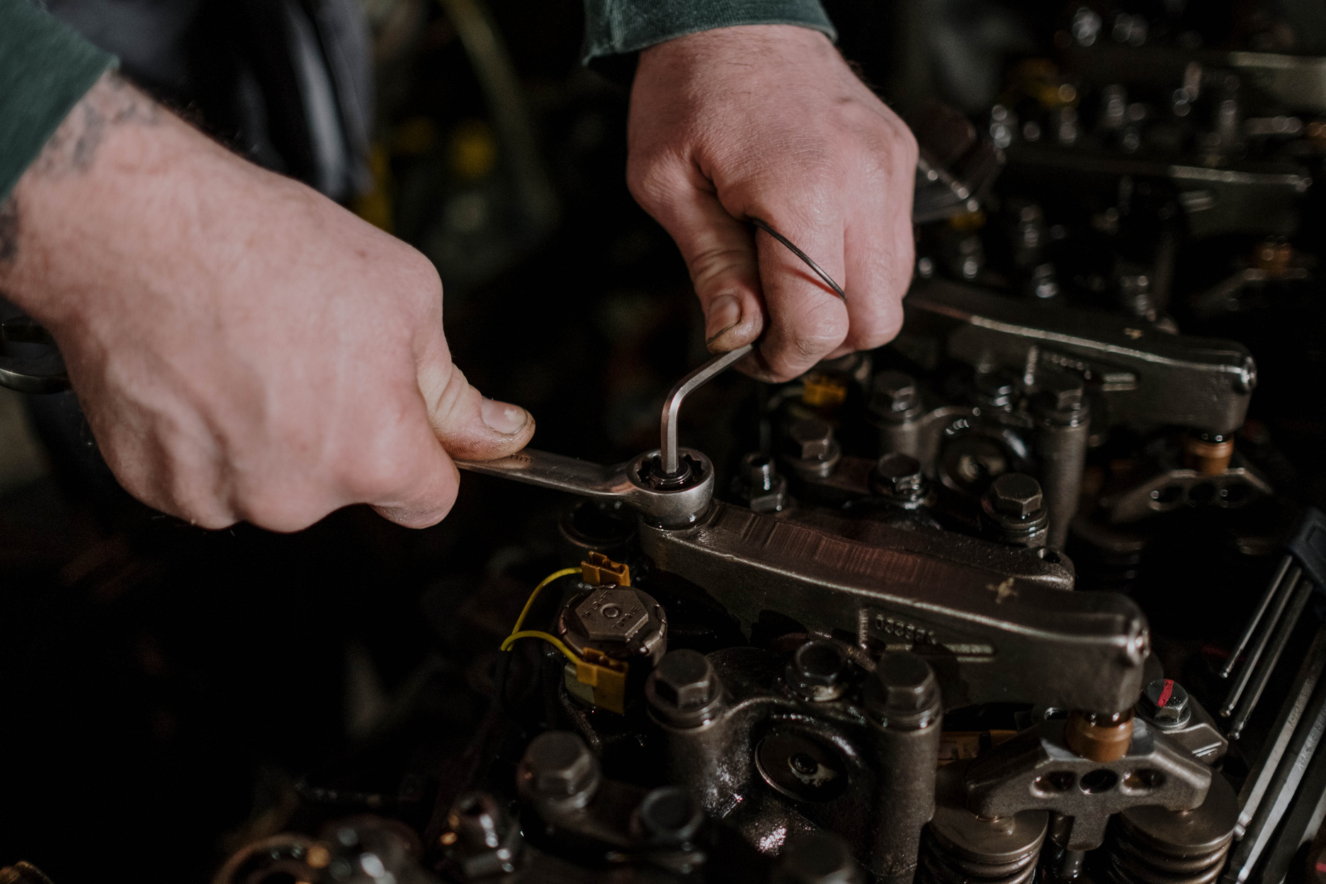 A Mechanic Fixing an Engine